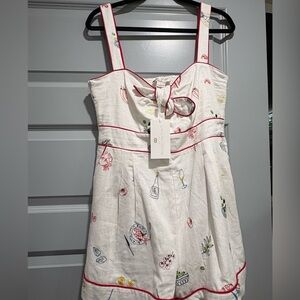 Caroline Constas White Linen Romper with Red Trim and Summer Print